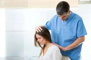 chiropractor giving a woman a aback massage