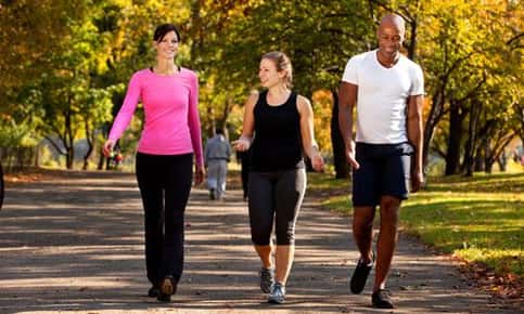 three people walking at the park