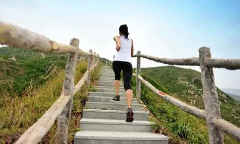 woman climbing strairs