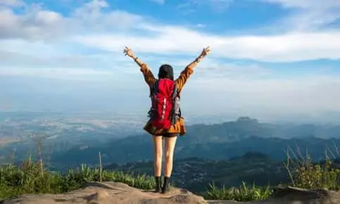 young woman raise hands in a v