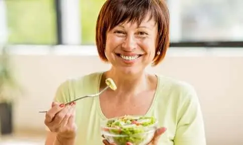 woman eating salad