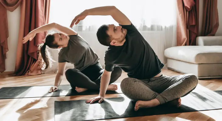 couple-stretching-together