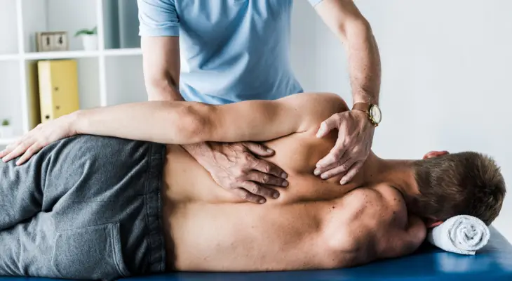 man-receives-chiropractic-adjustment