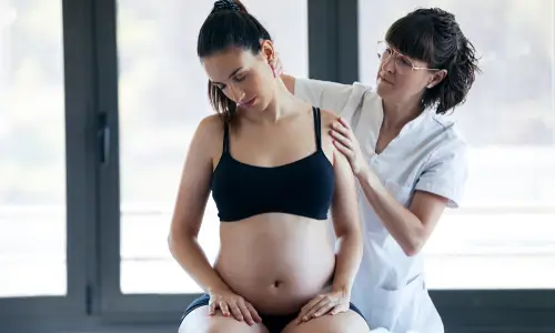 pregnant-woman-receiving-treatment-on-neck