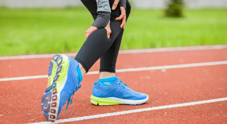 woman-grabbing-her-calf-in-pain