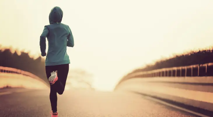 woman-runs-along-lonely-road