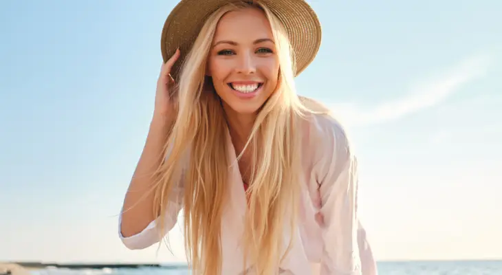 woman-smiles-on-the-beach