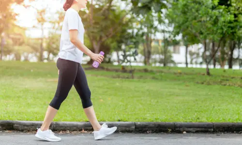 woman-walking-through-the-park