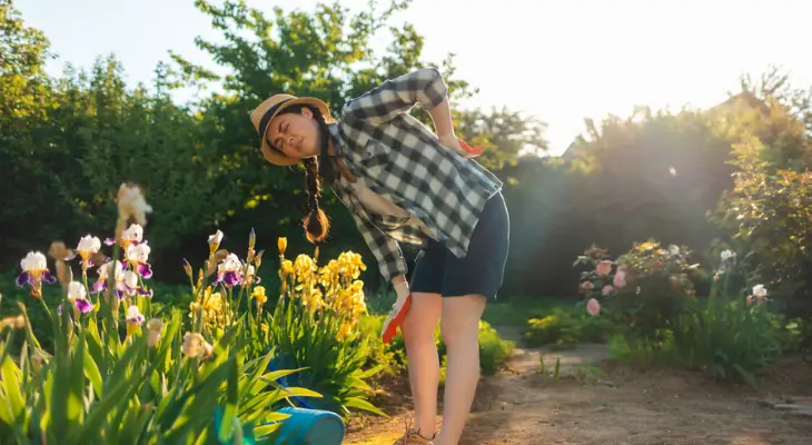 young-woman-feels-back-pain-while-gardening